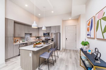 Kitchen with island seating at Morea Apartments in Pompano Beach FL
